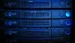 Firefly Close up macro photograph of a server front panel with rows of hard drive bays showing subtl